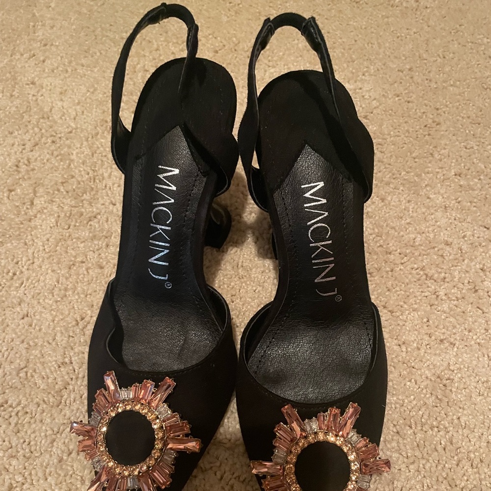 Black brooch pointed toe pyramid heels